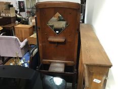 An oak 1930s mirror panel back hallstand with shelf and lift up glove box (h.184cm x 72cm x 30cm)