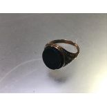 A yellow metal oval bloodstone mounted signet style ring (shank cut and repaired) (R) (3.29g)