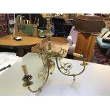 A 19thc brass fluted baluster column three branch centre light in the Victorian rococo taste, with