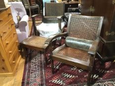 Two hardwood steamer style chairs with cane and rattan backs and seats, raised on turned and