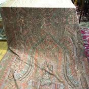 A 19thc machine made paisley shawl, the centre with boteh design enclosed within a stylised