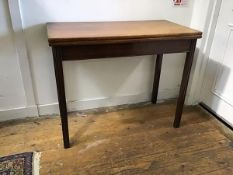 A 19thc mahogany rectangular fold over tea table, with moulded edge and plain frieze, raised on