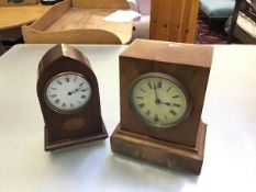 An Edwardian mahogany inlaid lancet style clock with arched top and enamelled dial, with roman