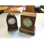 An Edwardian mahogany inlaid lancet style clock with arched top and enamelled dial, with roman