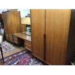 A teak 1960s three piece bedroom suite by Younger, comprising a lady's and gentleman's wardrobe, the