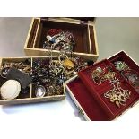 Two jewellery boxes containing a large collection of costume jewellery including bead necklaces,