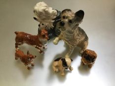 A collection of Royal Doulton china dog figures including Old English Sheepdog and Pup, two