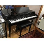 A Yamaha electronic Clavinova piano, stereo sampling CLP-555 with ebonised case complete with
