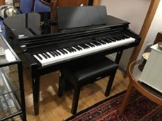 A Yamaha electronic Clavinova piano, stereo sampling CLP-555 with ebonised case complete with