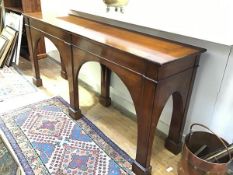 A yew wood hall table, the rectangular top with moulded edge with twin arched friezes, raised on