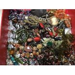 A box containing a large collection of costume jewellery including amethyst and glass bead