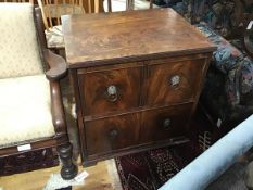 A 19thc mahogany dummy drawer front cabinet with fluted edge above a panel door, on plinth base (