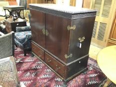 An Edwardian mahogany cabinet on stand, the top with gadroon carved edge and relief carved frieze