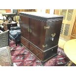 An Edwardian mahogany cabinet on stand, the top with gadroon carved edge and relief carved frieze