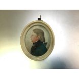 An early 19thc portrait miniature of a Gentleman with Green Top Coat, unsigned, on card (6cm x 4cm