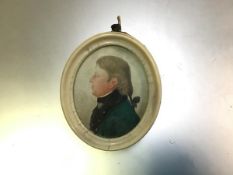 An early 19thc portrait miniature of a Gentleman with Green Top Coat, unsigned, on card (6cm x 4cm