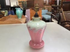 A Vasart pink, green and blue swirling design glass tablelamp,with original pierced side cable