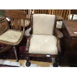 A Victorian childs mahogany open armchair with upholstered panel back and seat, raised on turned