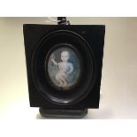 French School, late 18th century, a portrait miniature of an infant, oval, watercolour on ivory,
