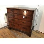 A George III mahogany chest of drawers, the rectangular top with moulded edge above two short and