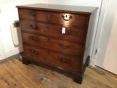 A George III mahogany chest of drawers, the rectangular top with moulded edge above two short and