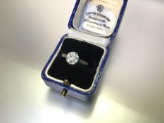 An early 20th century single stone diamond ring, the round brilliant-cut stone weighing approx. 1.