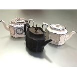 A group of three stoneware teapots, c. 1800, two in feldspathic white of shaped octagonal form,