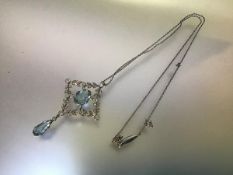 An Edwardian diamond and aquamarine pendant, claw-set to the centre with an oval-cut aquamarine