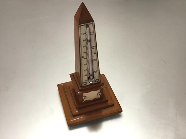 A 19th century ivory-mounted obelisk form treen desk thermometer, with stepped base. Height 16.5cm