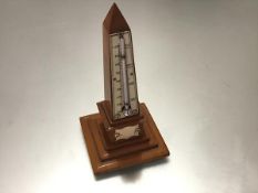 A 19th century ivory-mounted obelisk form treen desk thermometer, with stepped base. Height 16.5cm