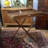 A handsome 19th century mahogany butler's tray on stand, the rectangular tray of characteristic form