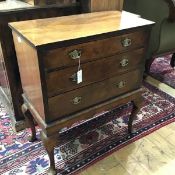 A walnut chest of drawers on stand in 18th century style, the rectangular top over three long