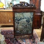 A large 19th century walnut framed needlework firescreen, the 17th/18th century style verdure