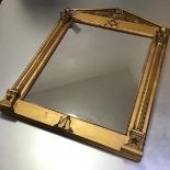 A 19th century giltwood and gesso mirror with Masonic emblems, the pedimented crest with scrolling