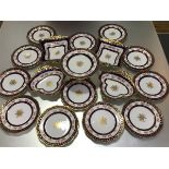 An Edwardian Aynsley dessert service, c. 1905-10, each piece centred by a gilt roundel, the rims