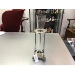 A late 19th century silver-plate and glass vase, the conical glass vessel in a tripod stand, the