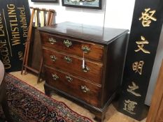 A small early George III mahogany chest of drawers, the rectangular top with moulded edge above