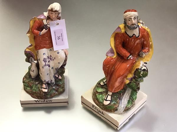 A pair of Staffordshire pearlware figures, c. 1810, Elijah and the Widow (of Zarepath), each