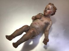 An 18th century painted gessoed terracotta creche figure of the Christ Child, possibly Neapolitan (