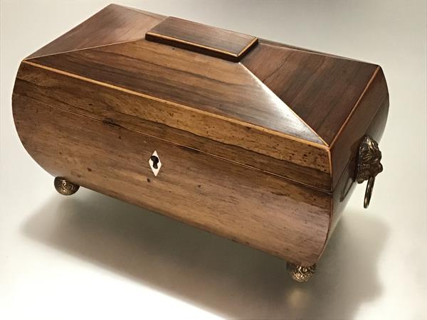 A handsome boxwood-lined rosewood tea caddy, second quarter, 19th century, of bombe sarcophagus