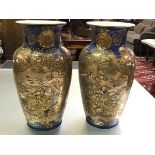 A pair of large Satsuma vases, Meiji period, c. 1900, each of baluster form, lavishly decorated in