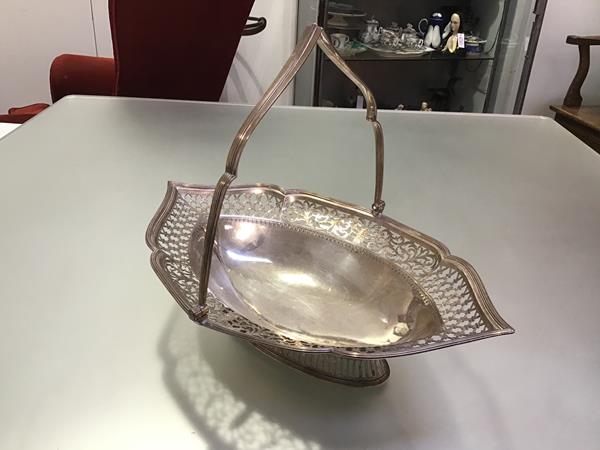 A George III silver cake basket, London 1813 (maker's mark indistinct), of shaped navette form,