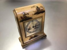 An early 20th century Chinoiserie lacquered mantel clock, the cream dial painted with an Oriental
