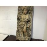 A large painted copper figural panel in high relief, 19th century, of a putto, emblematic of Autumn,