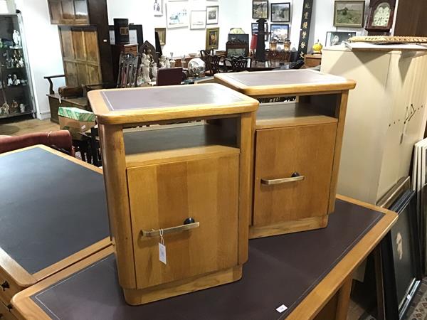 A pair of 1940's oak bedside cabinets by Abbess, each with rectangular top with rounded corners over