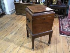 An early 19th century satinwood crossbanded mahogany cellarette, of square form, the hinged caddy