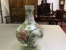 A Chinese porcelain flask form vase, possibly Republic period, the heavily potted body painted