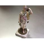 A Staffordshire pearlware figure of Diana, early 19th century, modelled standing, her left handing