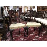 A pair of Edwardian mahogany side chairs in George II style, each with shell-carved crest rail