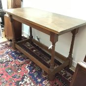 An Arts & Crafts oak side table in the manner of Edwin Lutyens, of refectory table form, the solid